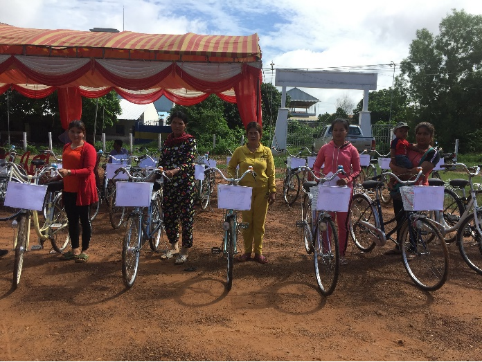 Volunteers with donated bicycles